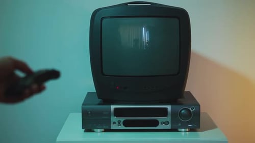 Turn on the Remote Control Vintage TV with Noise and Static Decrease