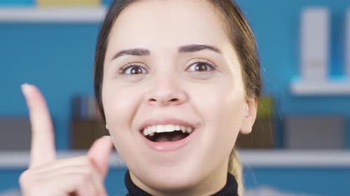 Close-up of young woman finding a good idea.