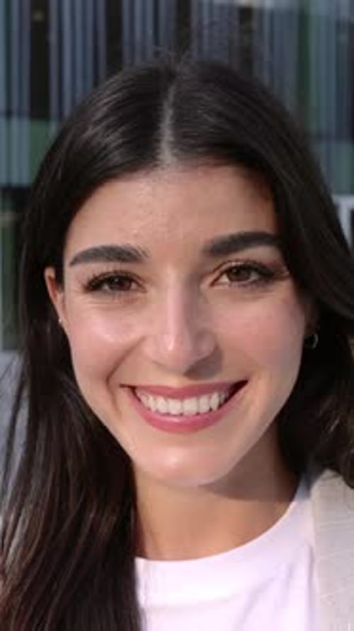 Happy Portrait of Young Businesswoman Standing Over Company Office Building