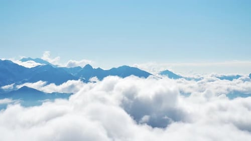Blue Mountains Partially Obscured by Dreamy White Clouds