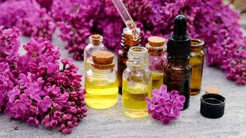 Essential Oils with Flowers and Dropper Close Up