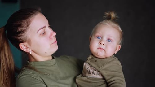Loving Mother Holding Her Beautiful Baby