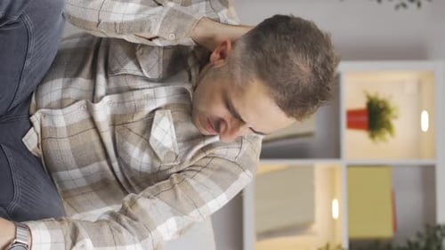 Vertical video of Man with neck pain.