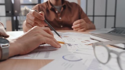 Business Team Analyzes Data at Modern Office