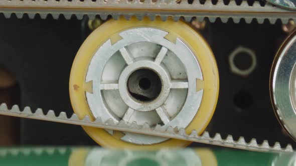 Toothed belt rotating around yellow wheel, Industrial Stock Footage ft ...