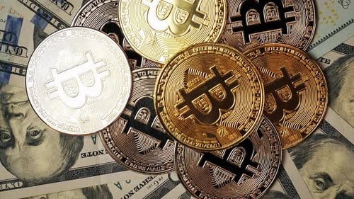 Top view of bitcoinі rotating on dollars bills. Cryptocurrency. Vertical video