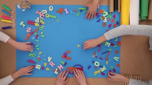 Children playfully learn the alphabet on the floor back to school season