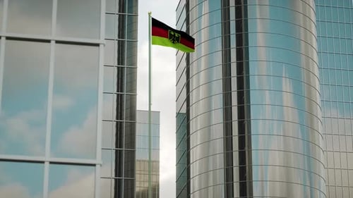Waving German Flag On Modern Skyscraper Building