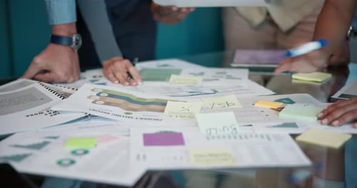 Team Analyzes Financial Data in Corporate Meeting