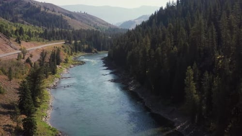 Aerial drone shot of Snake River in Alpine, Wyoming. Epic view of clear blue water and rocky riverba