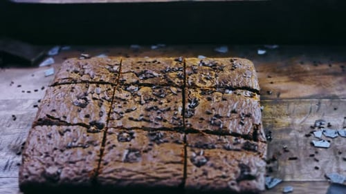 Freshly Cut Chocolate Brownies on Wooden Surface