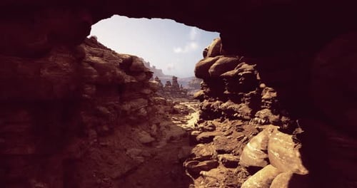 Discovering Unique Rock Formations Through a Natural Archway in the Desert