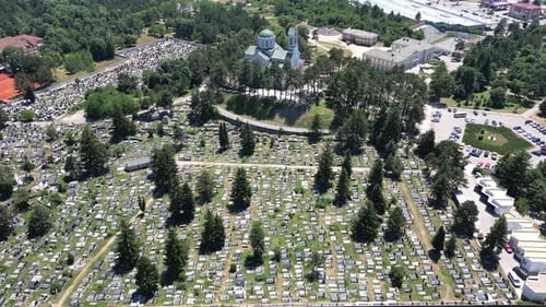 A Drone Flies Past a Christian Cemetery in a Mountain Town in Southern Europe