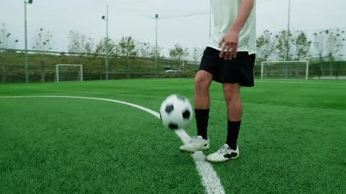 Sporty Teenager Soccer Player Does Freestyle Soccer In The Field