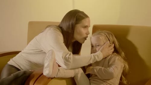 Loving Woman and Child in an Indoor Setting