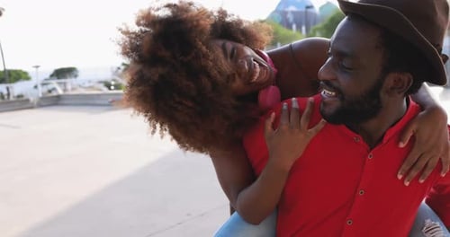 Happy Couple Piggyback Ride in Urban Outdoor Setting