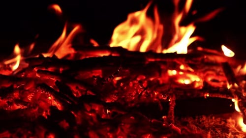 Fireplace firing on dark. Burning bonfire motion.