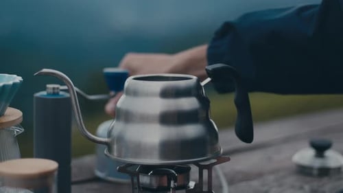 Kettle Heating on Stove While Camping Outdoors