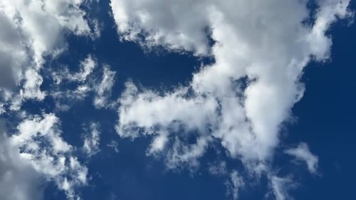 Clouds Flying on a Deep Blue Sky