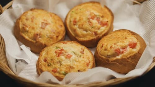Bacon and Cheese Rolls in a Wicker Basket Close Up