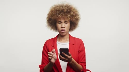 Woman Receive Negative Message on Smartphone on White