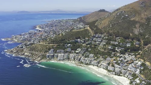 4k aerial drone footage of a beautiful city and residential area along the coast