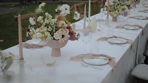 Elegant Wedding Table Decoration with Flowers and Candles