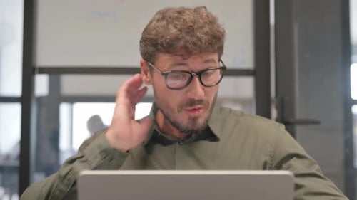 Close up of Middle Aged Man with Neck Pain at Work