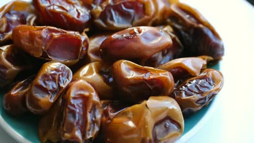 Healthy Fresh Dates Rotating in a Bowl