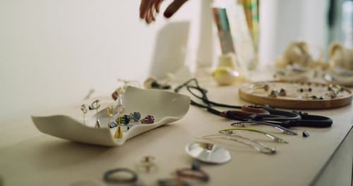 Fashionable female customer trying on a ring in boutique clothing store
