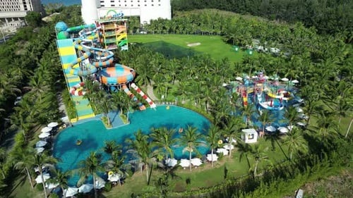 Aerial View of Tropical Resort with Adventure Waterpark Aquapark Water Slides and Pool Area Family