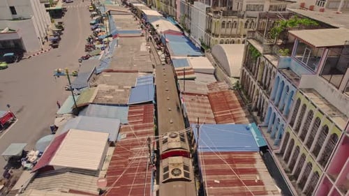 Aerial view of bustling railway market, Thailand.