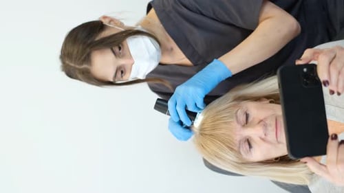 Senior Woman Scalp Exam at Dermatology Office