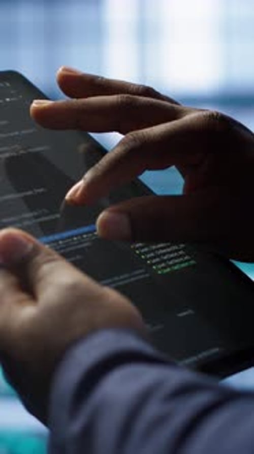 Vertical Video Close Up Shot of Worker in Server Room Using Tablet
