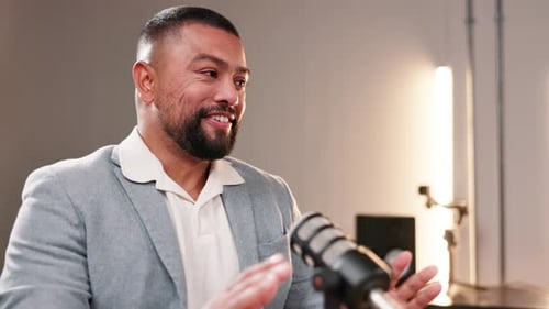 Interview, business and man with microphone on podcast or broadcast for youth empowerment