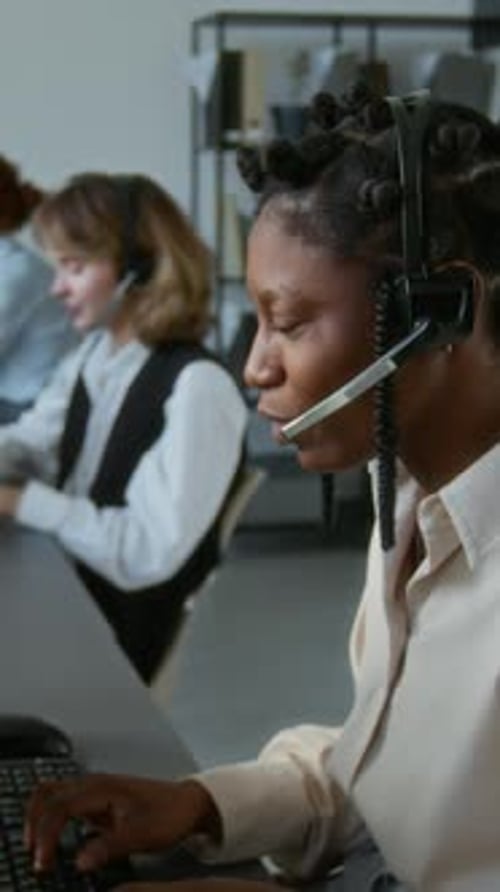Customer Service Representatives Working in Modern Office