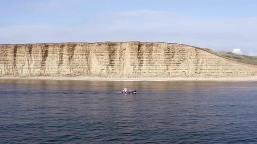 Commercial Fishing Vessel Heading out to Sea in the UK
