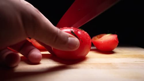 Tomato Sliced on Wooden Cutting Board Close Up