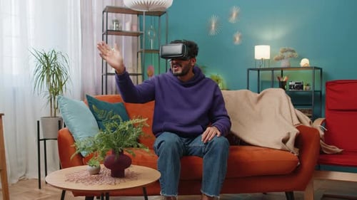 Man Experiences Virtual Reality on Couch at Home