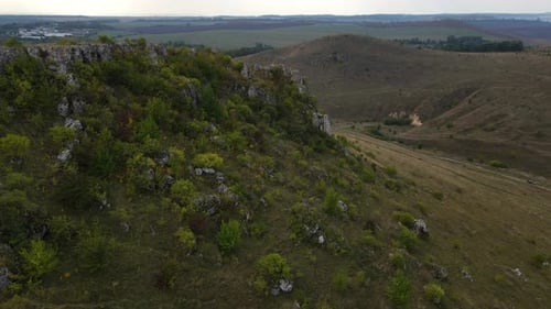 Aerial View on the Rocky Hill Drone Flies Forwards Over Stony Landscape