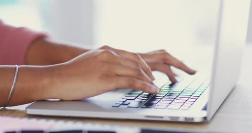 4k video footage of an unrecognizable young businesswoman working on her laptop in the office