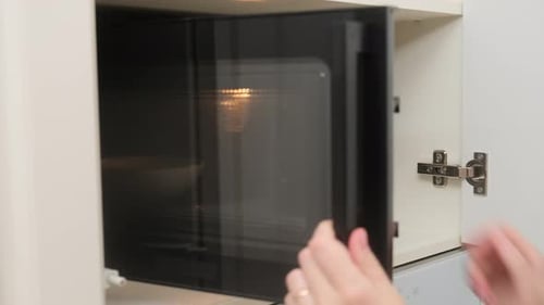 Operating a Microwave Oven in the Kitchen
