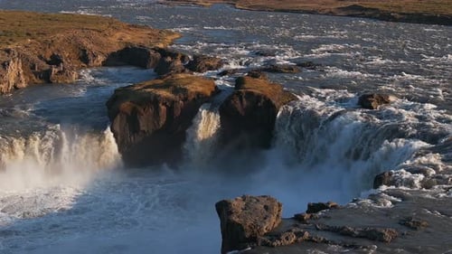 Aerial View of the Powerful Godafoss Waterfall on a Sunny Day in Northern Iceland