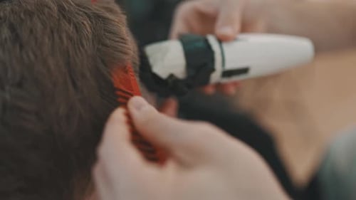 Haircut Close Up with Trimmer and Comb