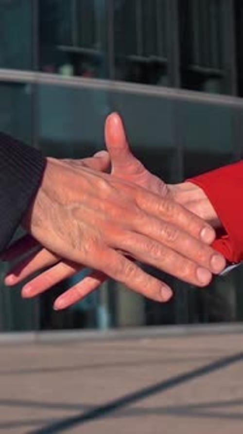 Business Handshake In Front Of Office Building