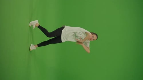Vertical Video Female Dancer Performing a Dance on Green Screen Street Dancing