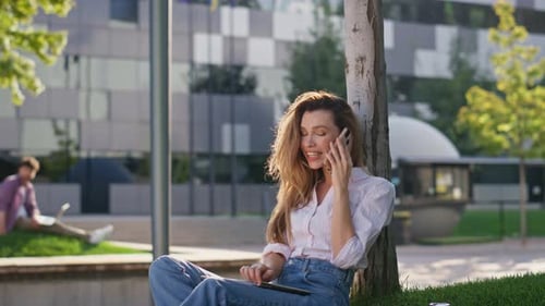 Smiling Girl Communicating Smartphone with Friend in Park Pretty Woman Resting