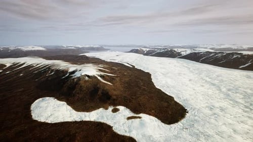 A Breathtaking Snowcovered Mountain Range Seen From Above