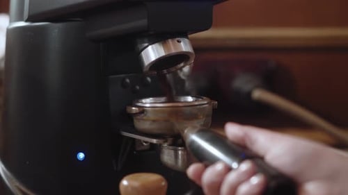 The Holder is Installed in Grinder for Filling with Ground Coffee at the Coffee Shop Coffeehouse