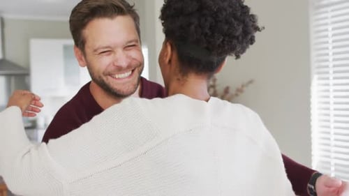 Happy Couple Embracing in Their Home